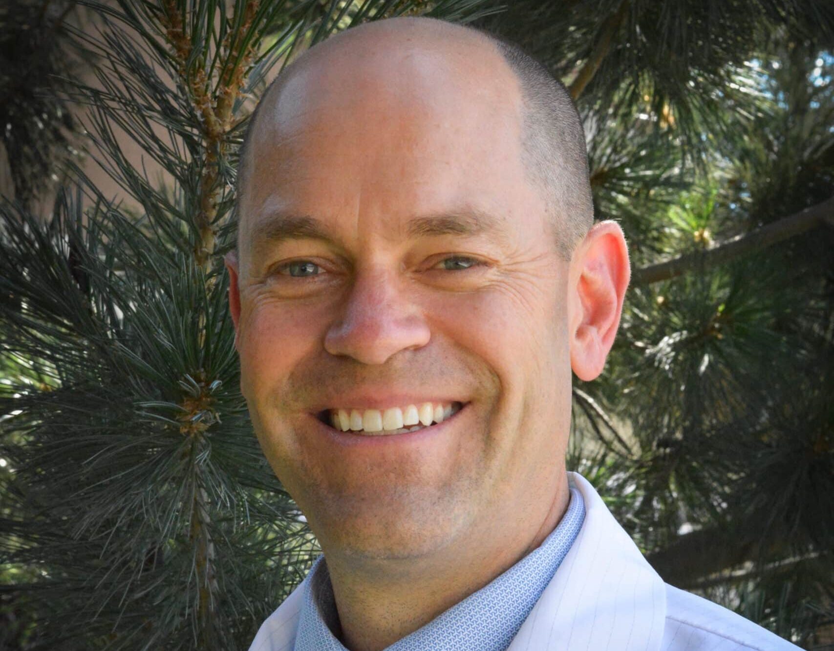 Headshot of Dr. Taylor Clark guest on MDIB Podcast